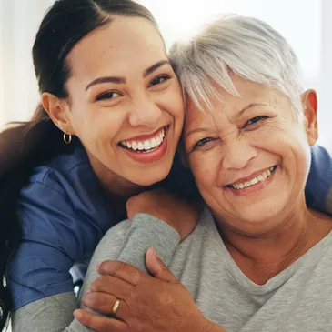 A warm, intimate moment between two people, one embracing the other, showcasing a connection filled with love and care.
